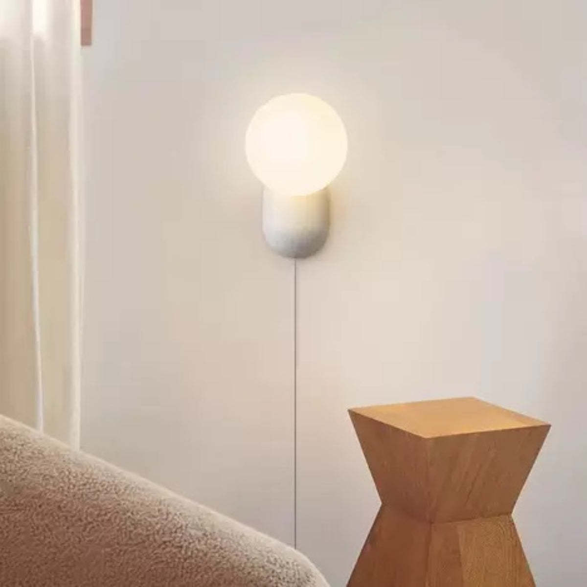 Hailie wall lamp illuminating a modern interior