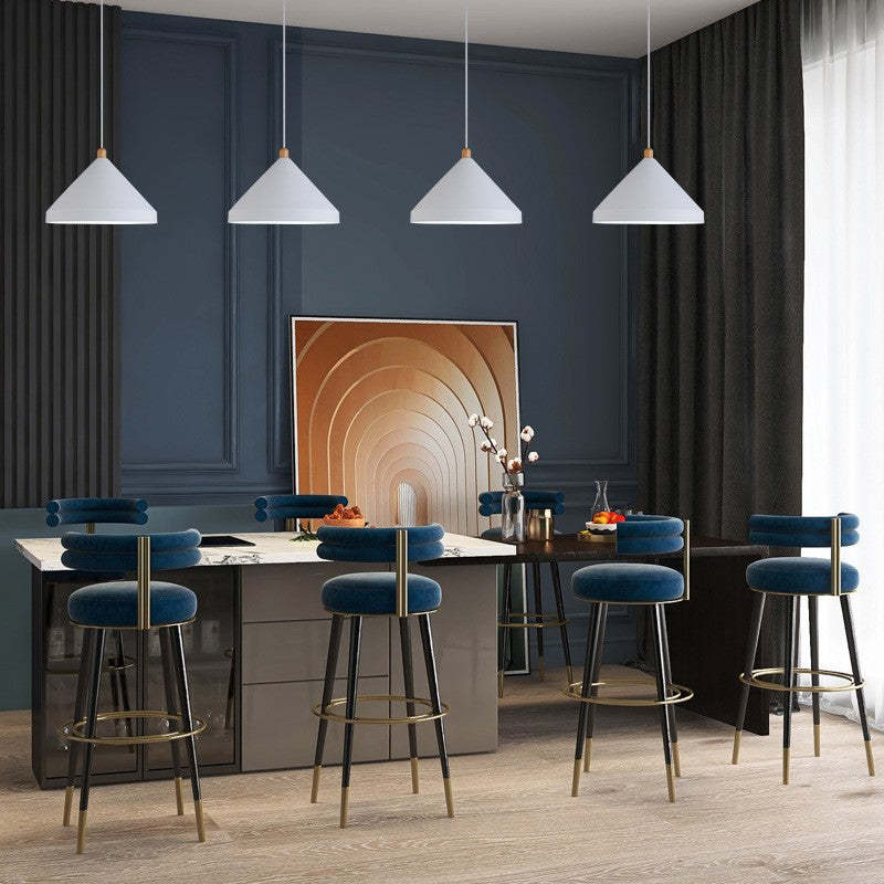 White Hailie pendant lights over dining table, contemporary design