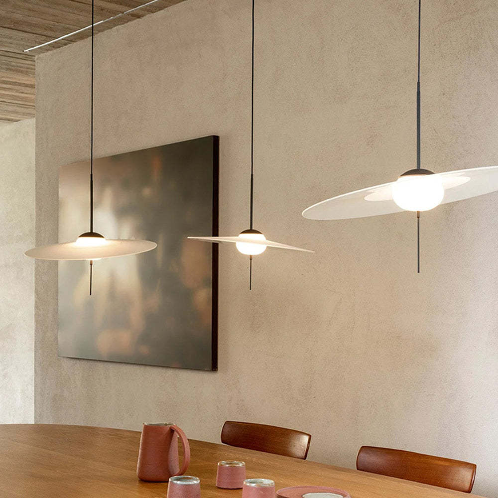 Modern round pendant lights over dining table