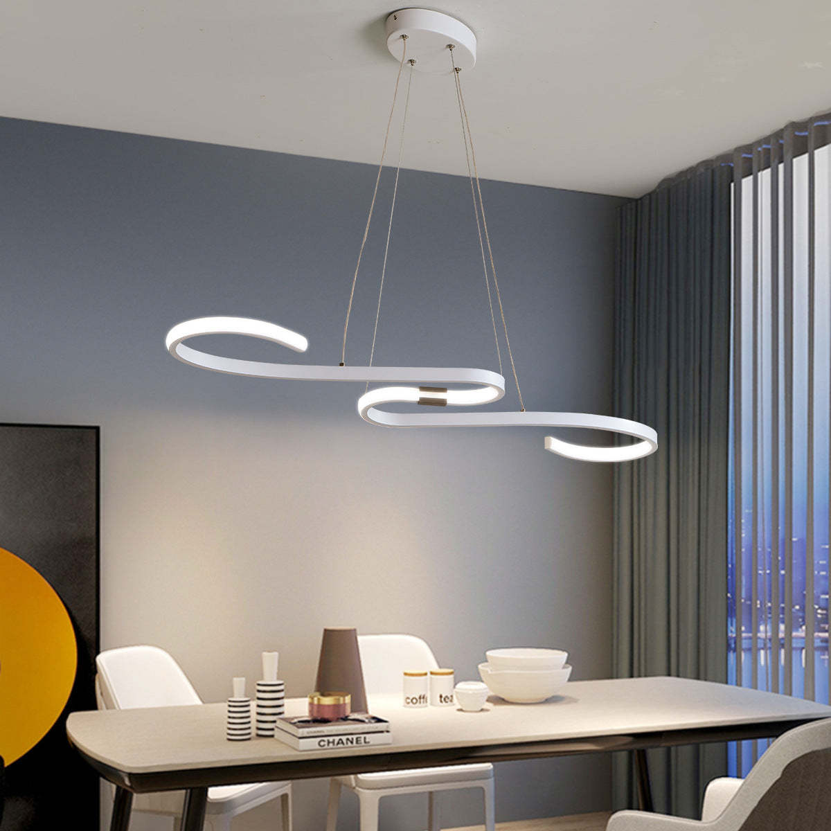 White Louise linear pendant light over dining table.