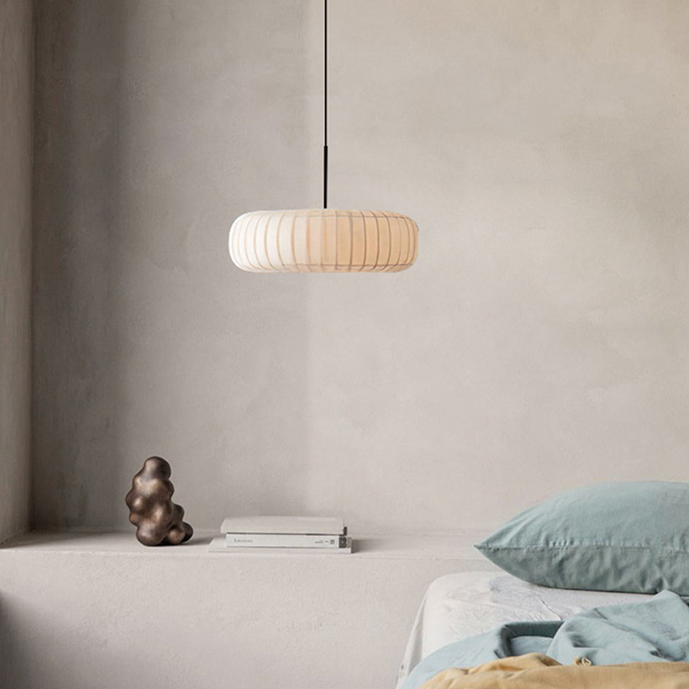 Renée Round Pendant Light in bedroom setting, minimalist design