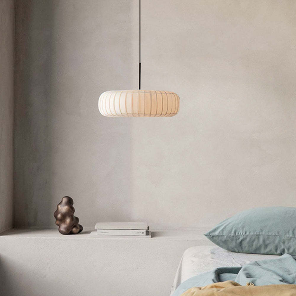 Renée Round Pendant Light in bedroom setting, minimalist design