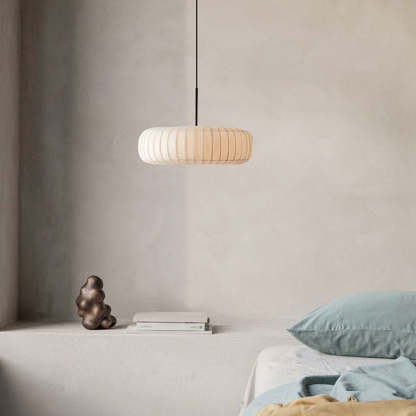 Renée Round Pendant Light in bedroom setting, minimalist design