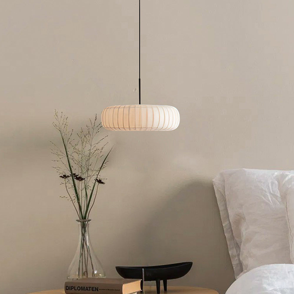 Renée round fabric pendant light in bedroom setting