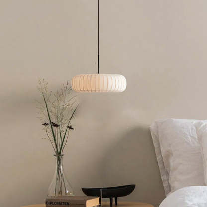 Renée round fabric pendant light in bedroom setting