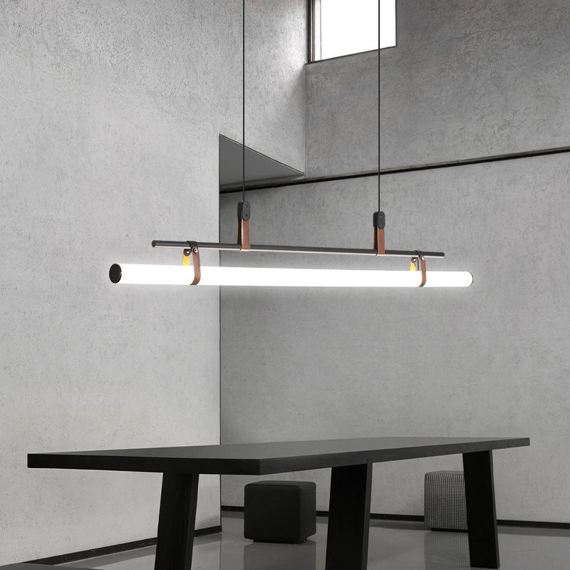 Edge linear pendant light above modern dining table by Las Sola