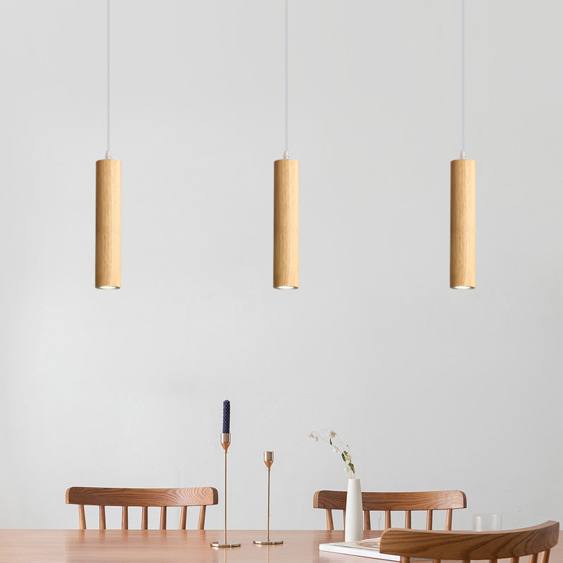 Dining room featuring Ozawa wood pendant lighting