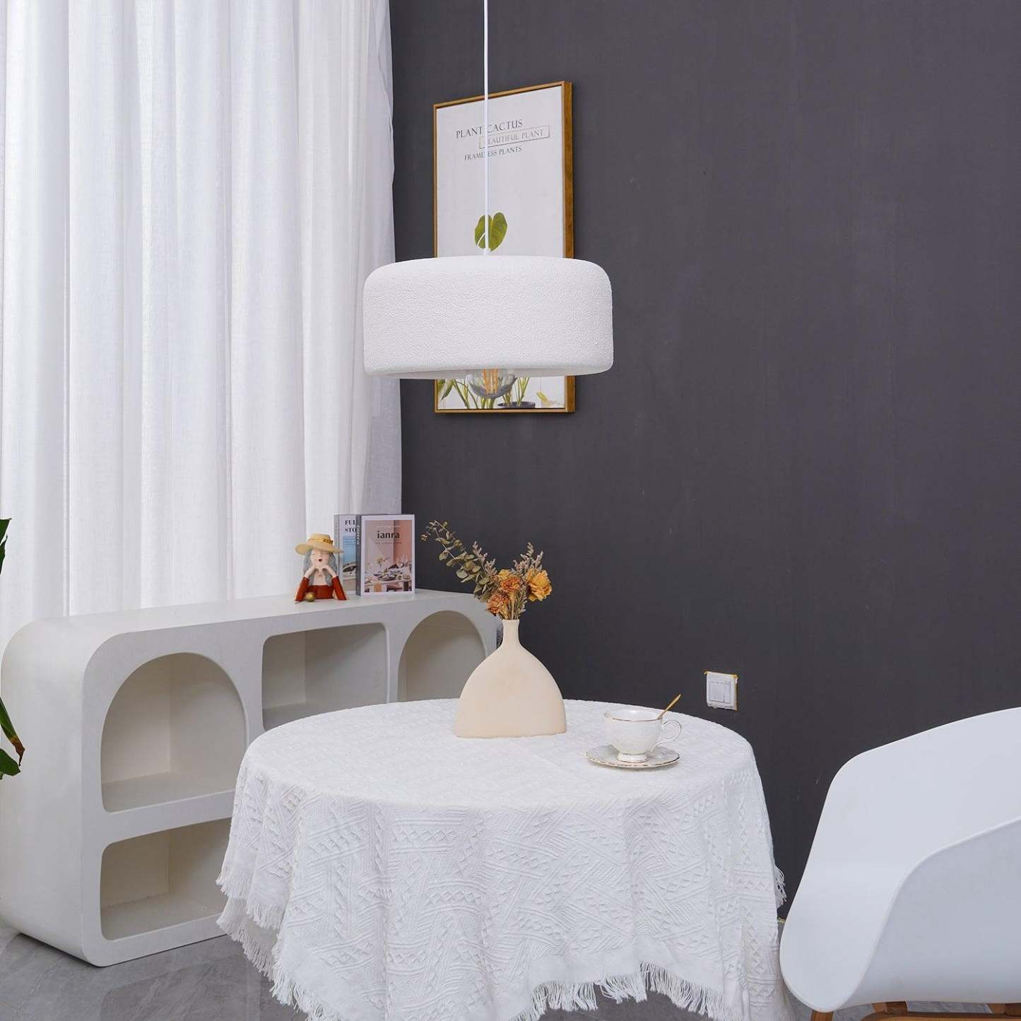 Gray cloud dome pendant light over round table setting