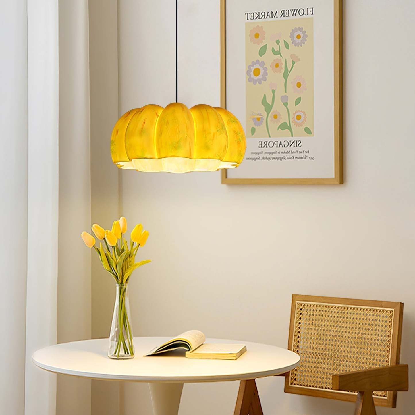Nielsen Pumpkin Pendant Light in a Bedroom Setting with flowers and a modern design
