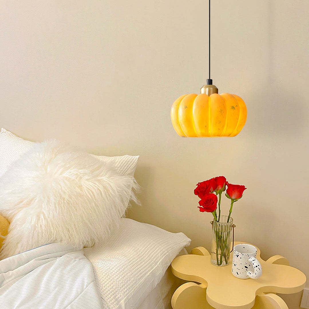 Nielsen Pumpkin Pendant Light in bedroom with flowers
