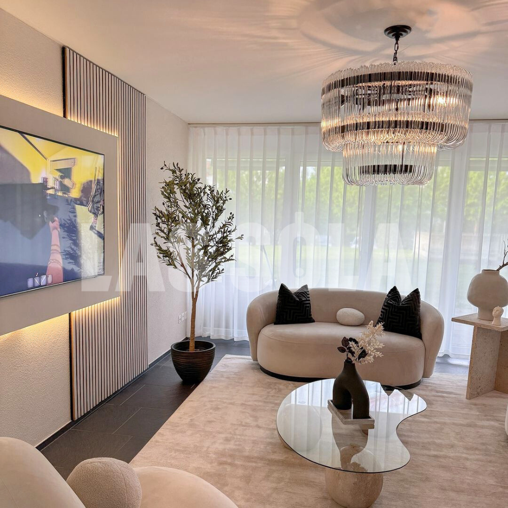 Marilyn Chandelier illuminating a modern living room setting