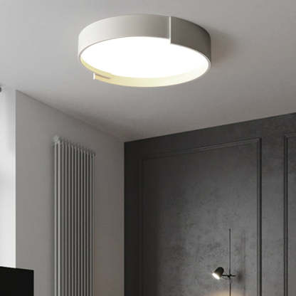 Quinn Modern Round Flush Mount Ceiling Light, illuminating room.