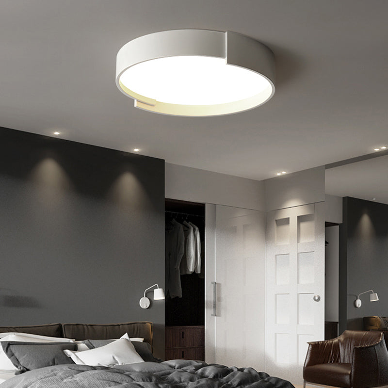 Quinn Modern Round Ceiling Light illuminating a bedroom