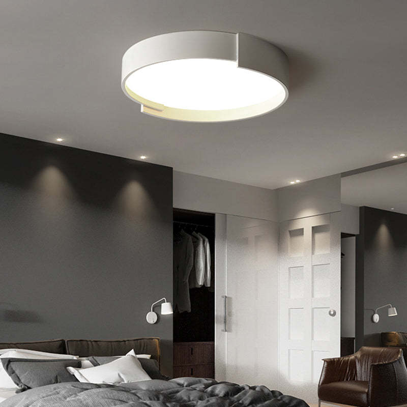 Quinn Modern Round Ceiling Light illuminating a bedroom