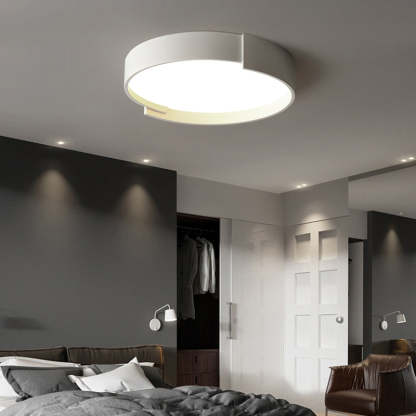 Quinn Modern Round Ceiling Light illuminating a bedroom
