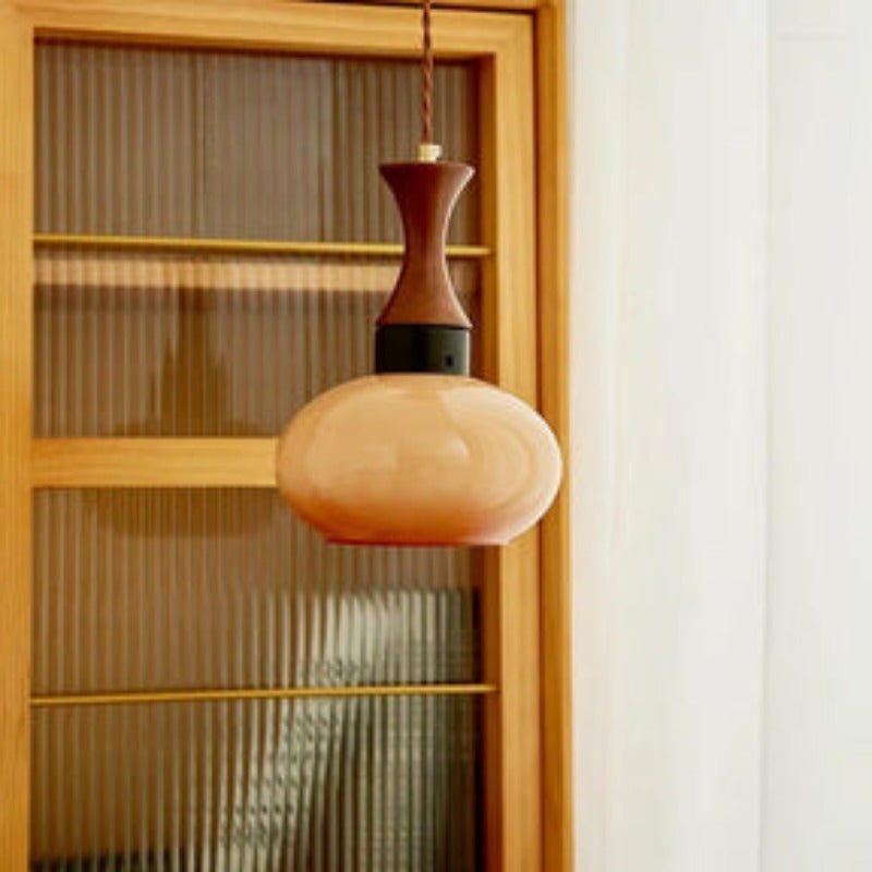 Brown glass pendant light in a living room.