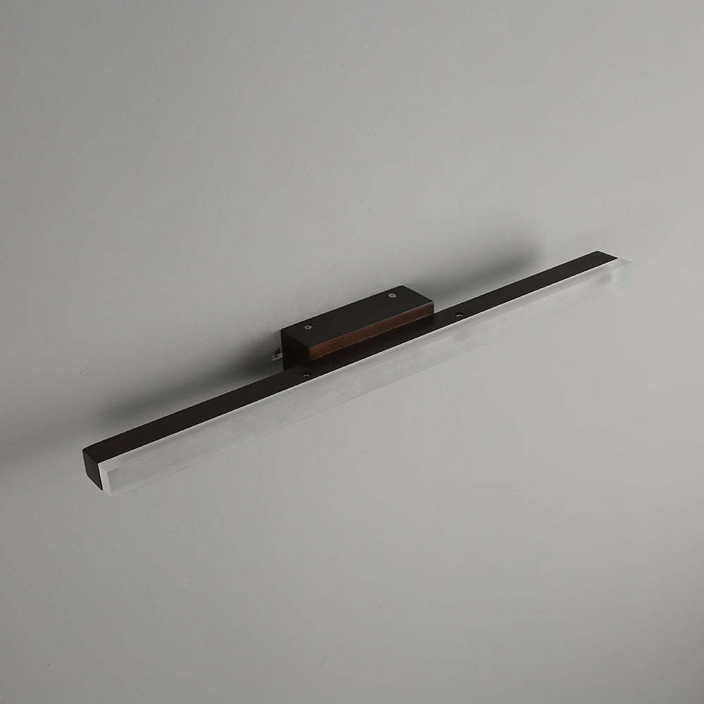 Leigh minimalist wood wall lamp. Walnut finish from Las Sola.