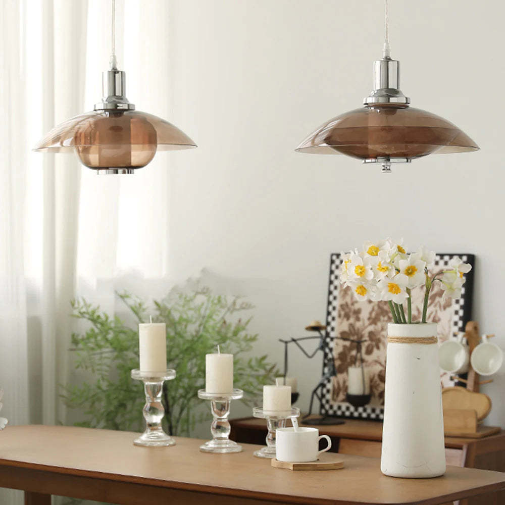 Cairns pendant lights over dining table with decor