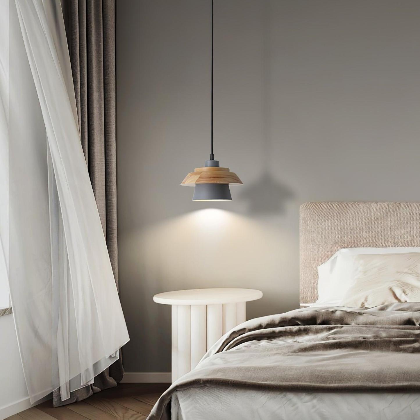 Zaid Pendant Light illuminating a modern bedroom with wooden accents