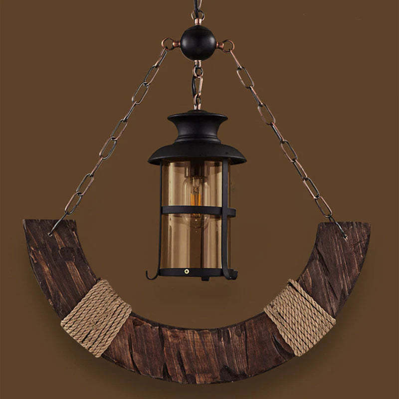 Austin wood pendant light with glass lantern shade.