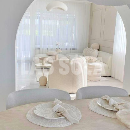 Byers cloud pendant light in bright, modern living room.