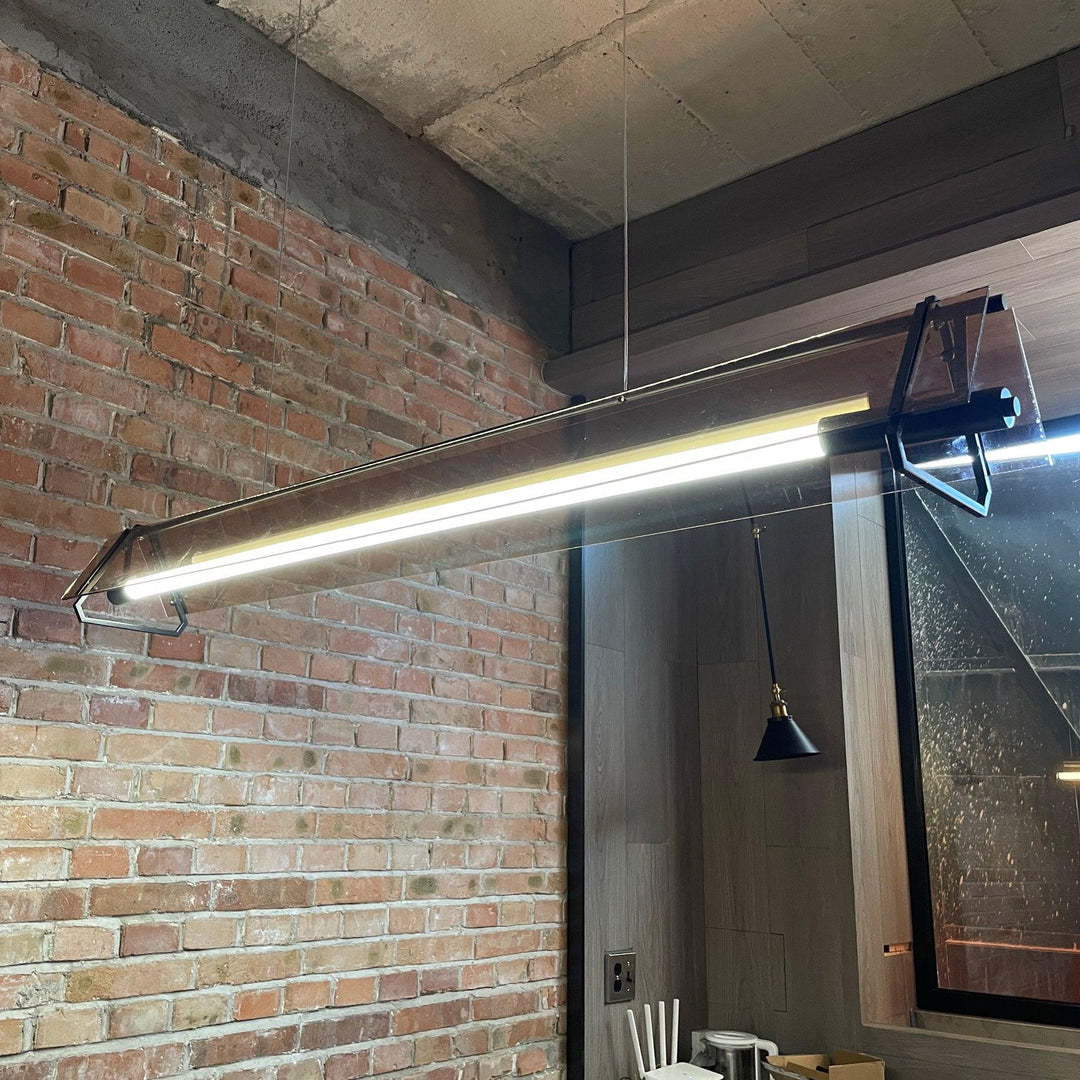 Edge Industrial Pendant Light illuminates modern brick interior