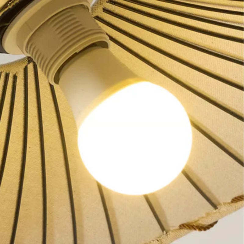 Close-up of lit Byers Wabi-Sabi pendant light bulb