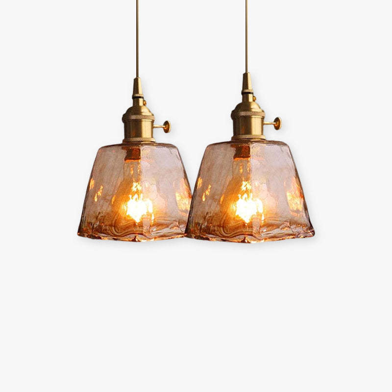 Two Levy vintage industrial pendant lights with glass shades.