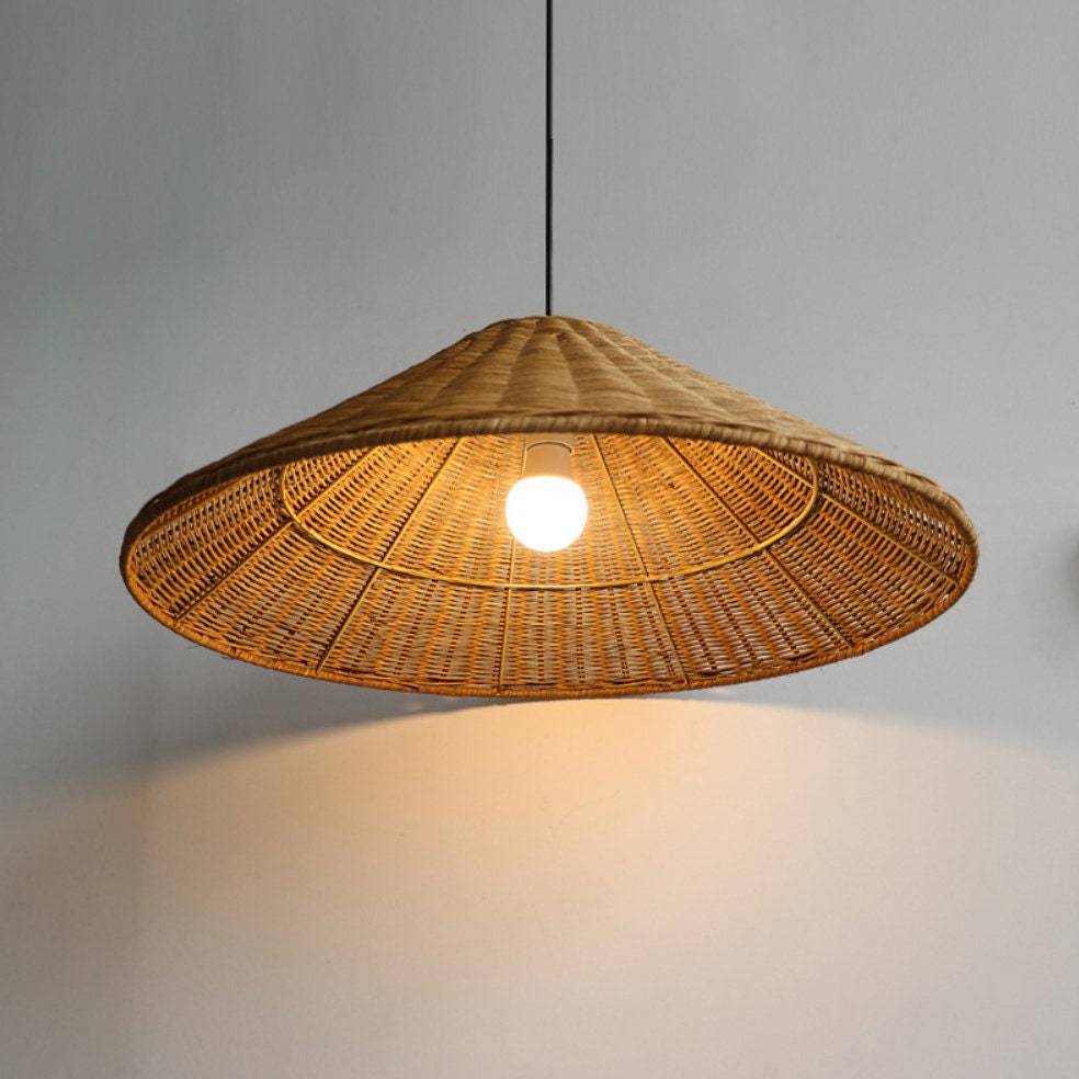 Muto Rattan Pendant Light with illuminated bulb