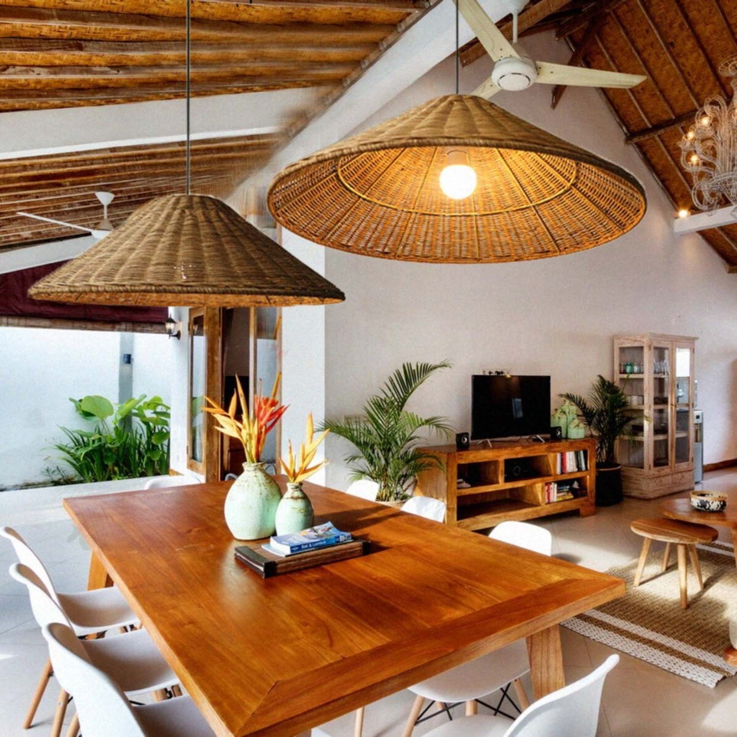 Rattan pendant lights above a wooden dining table