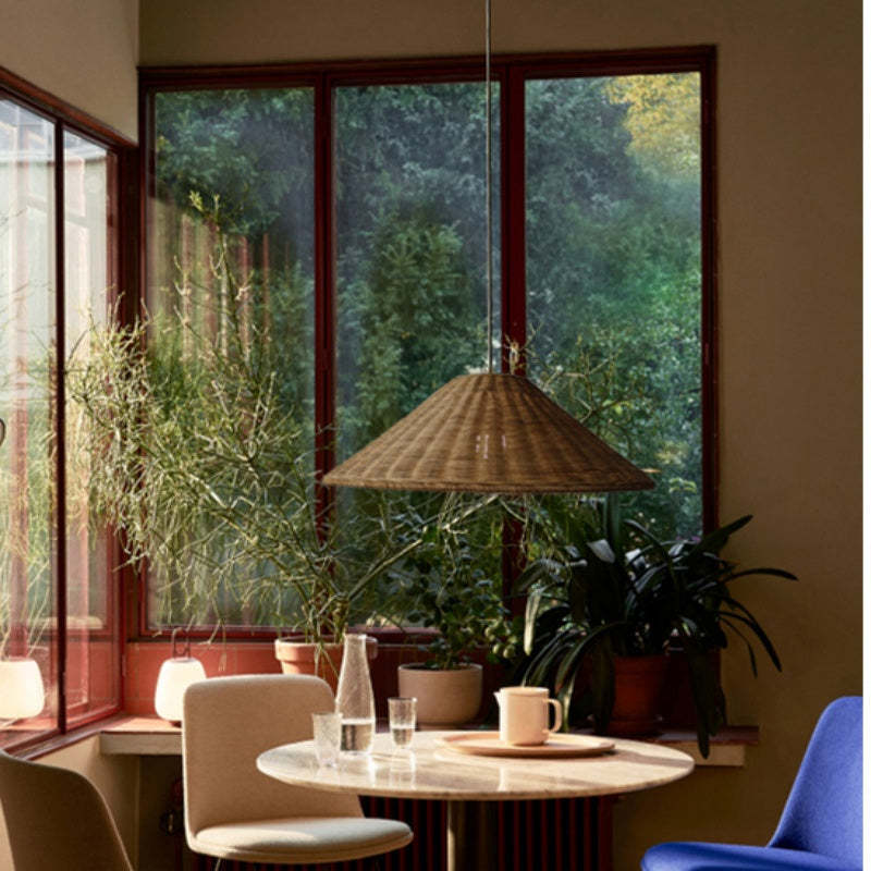 Rattan pendant light over a round dining table