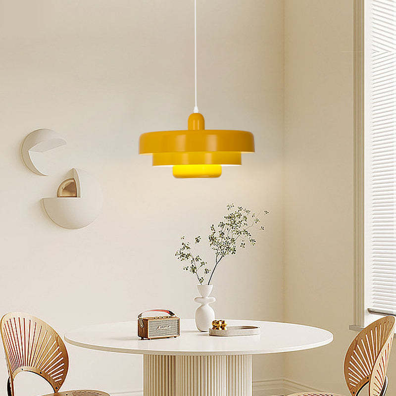Yellow Morandi Pendant Light over round dining table.
