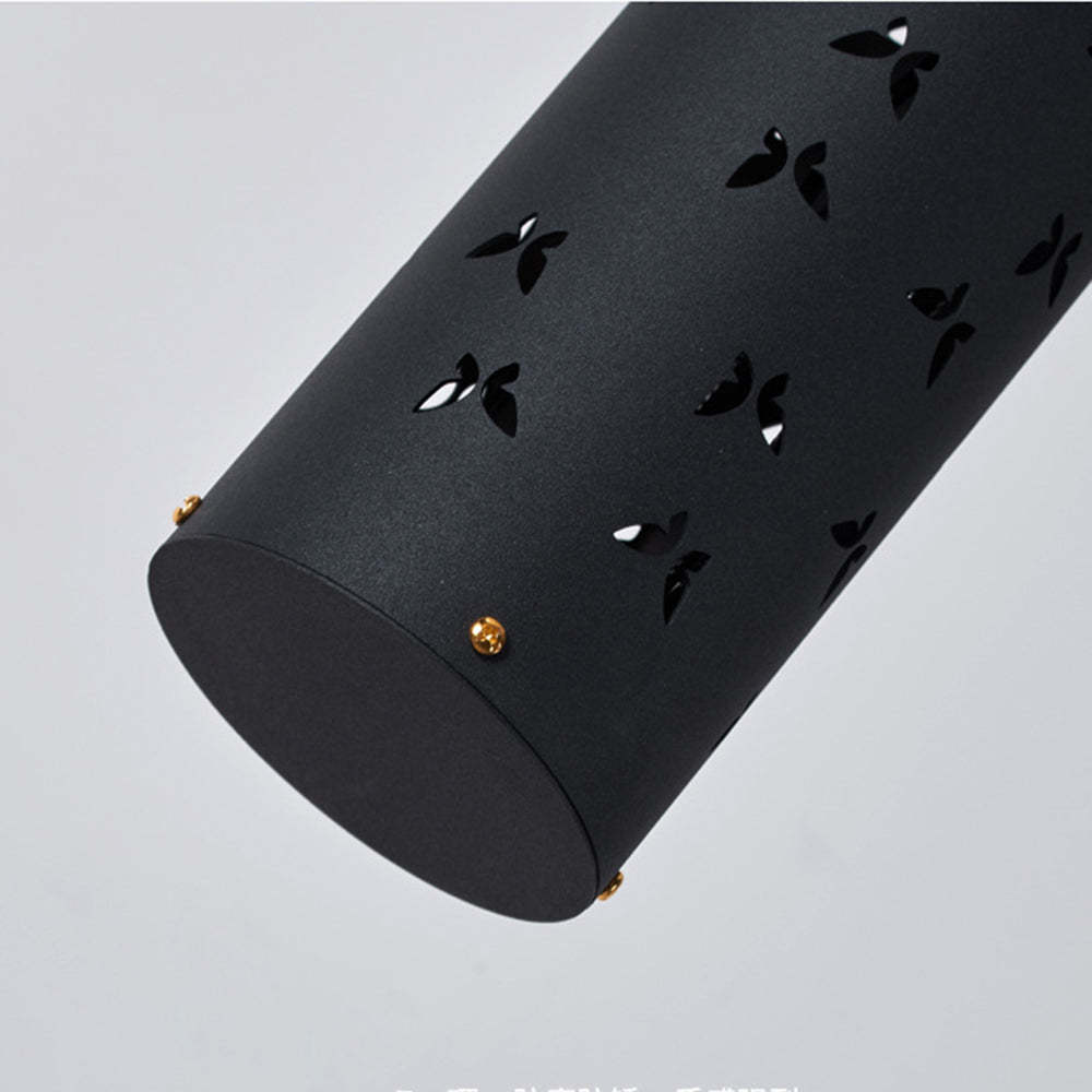 Close-up of black metal Kady floor lamp with butterfly cutouts
