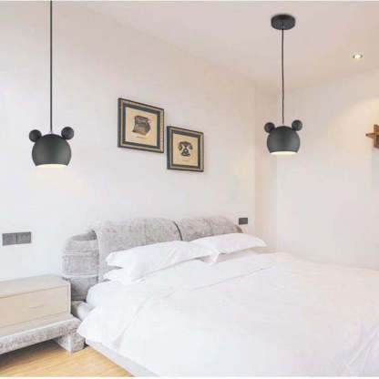 Las Sola: Black cartoon pendant lights in bedroom setting.