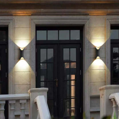 Orr LED Wall Light illuminates outdoor corridor.