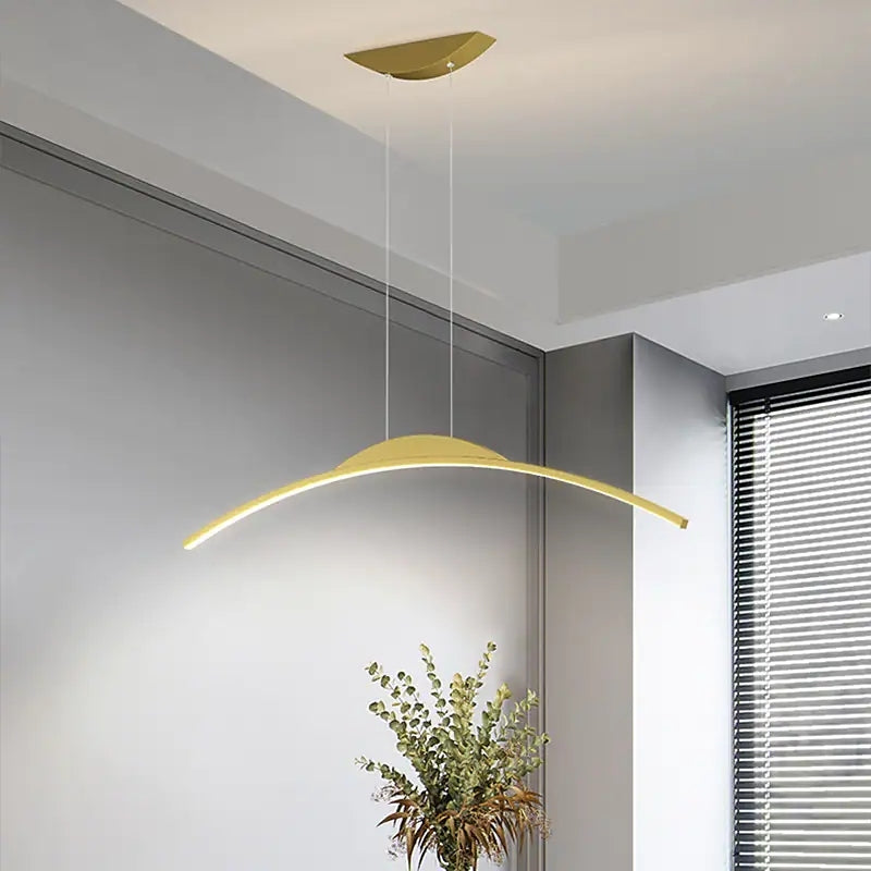 Gold linear pendant light. Minimalist LED lighting fixture.