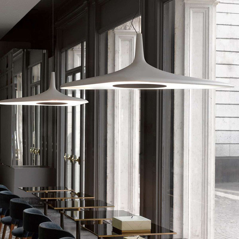 White Carins pendant lights over dining tables