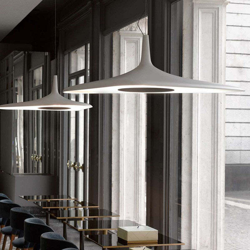 White Carins pendant lights over dining tables
