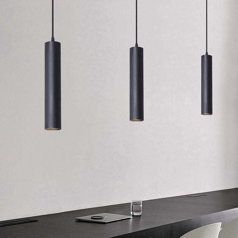 Edge modern cylinder pendant lights over a workspace