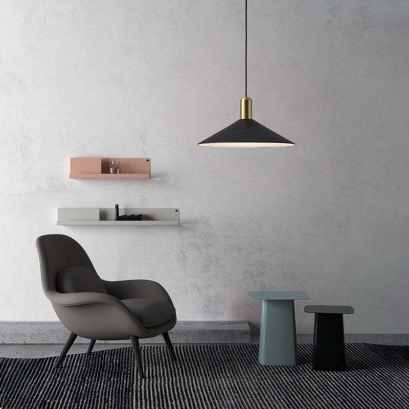 Carins black pendant light illuminates a modern living room. Carins Vintage Pendant Light