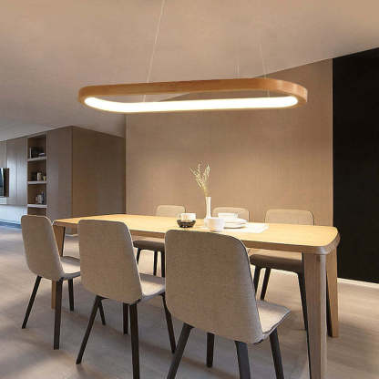 Ozawa oval wood pendant light illuminating dining area.