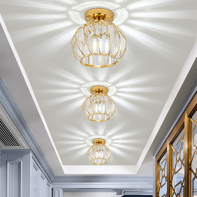 Gold crystal ceiling lights illuminating hallway