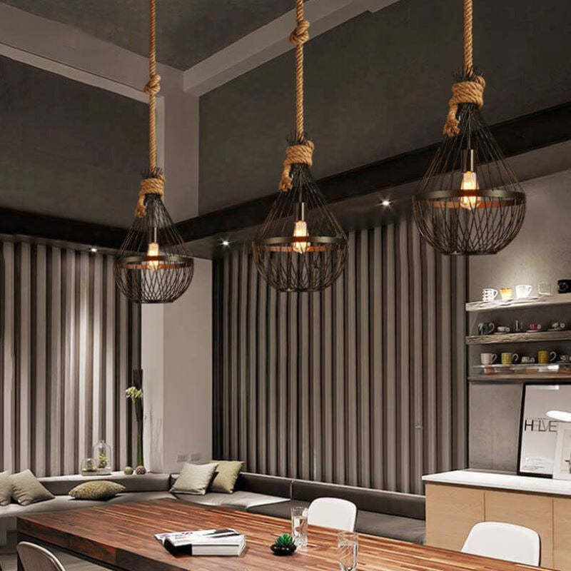 Industrial teardrop pendant lights over dining table