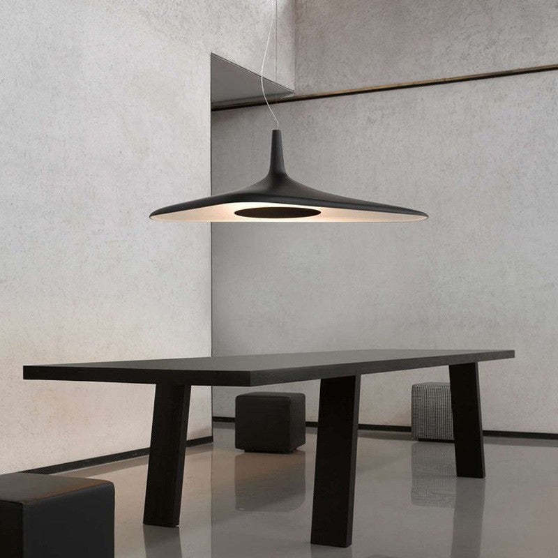 Carins modern black pendant light above dining table
