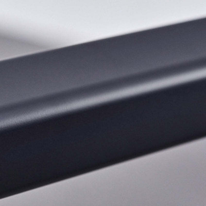 Close-up of black Edge pendant light's linear design.