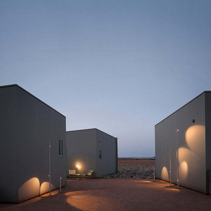 Outdoor lighting illuminating modern buildings at dusk