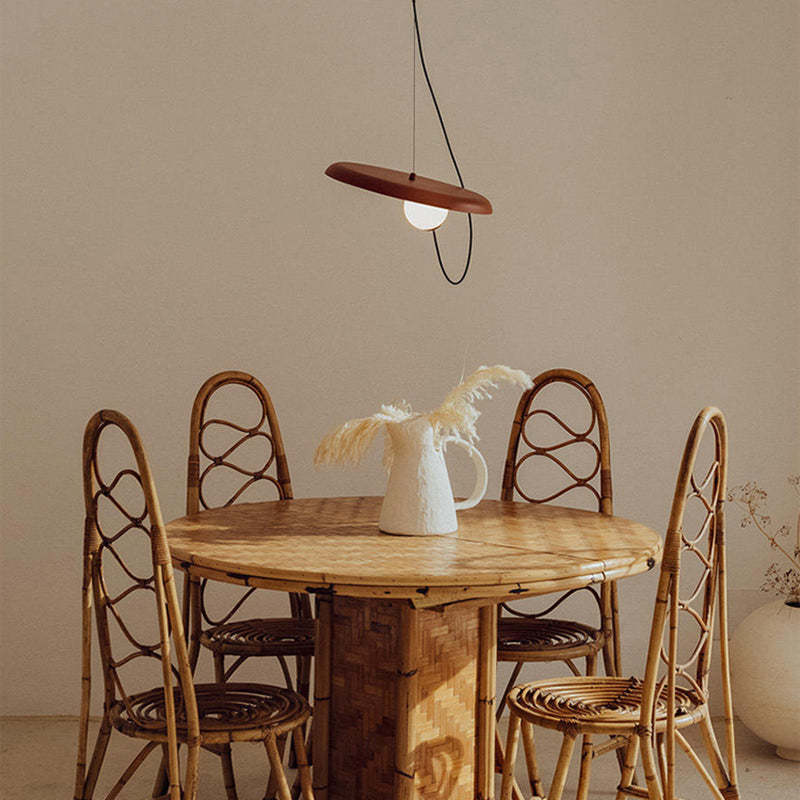 Avi pendant light above rattan dining set, Las Sola lighting.