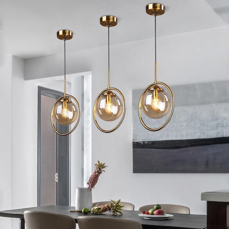 Glass pendant lights with gold ring. Contemporary lighting.