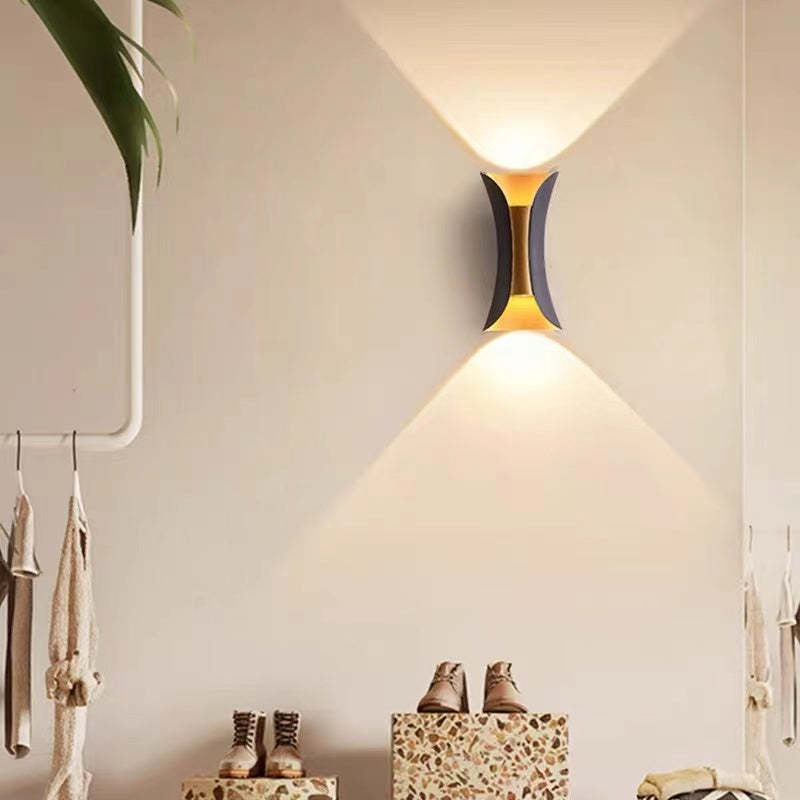 Orr LED Outdoor Wall Light with warm glow in corridor