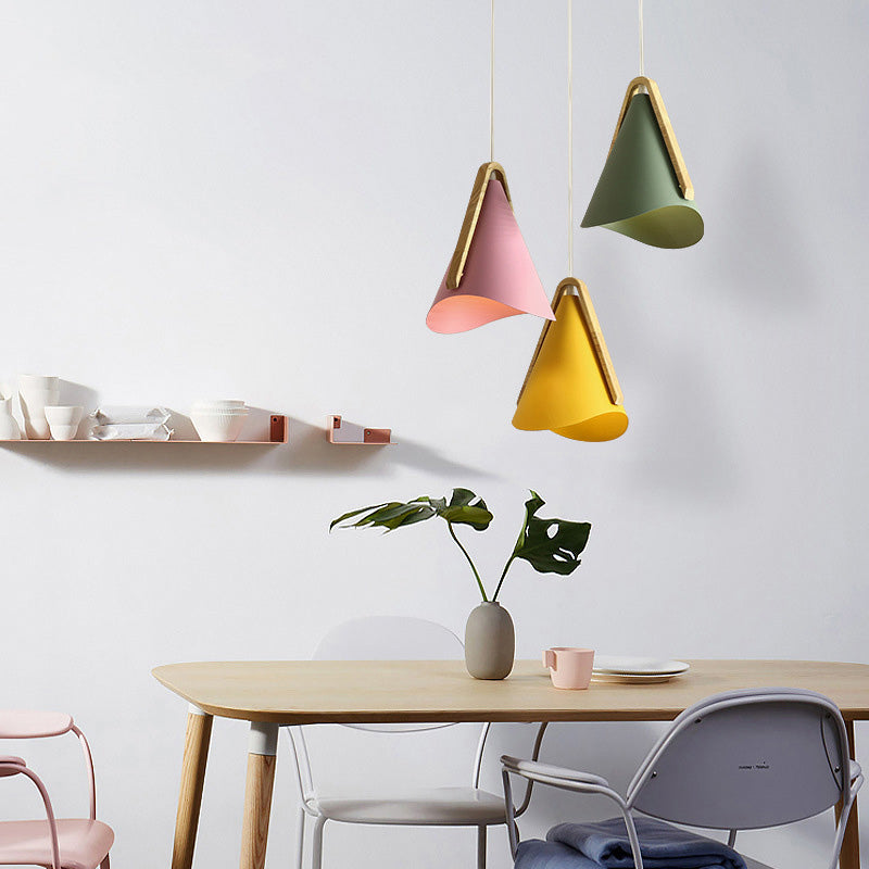 Colorful cone pendant lights in modern dining room.